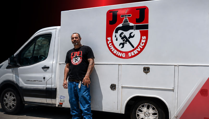 Joe Pergis standing next to the J&J Plumbing company branded service van in Bakersfield, CA