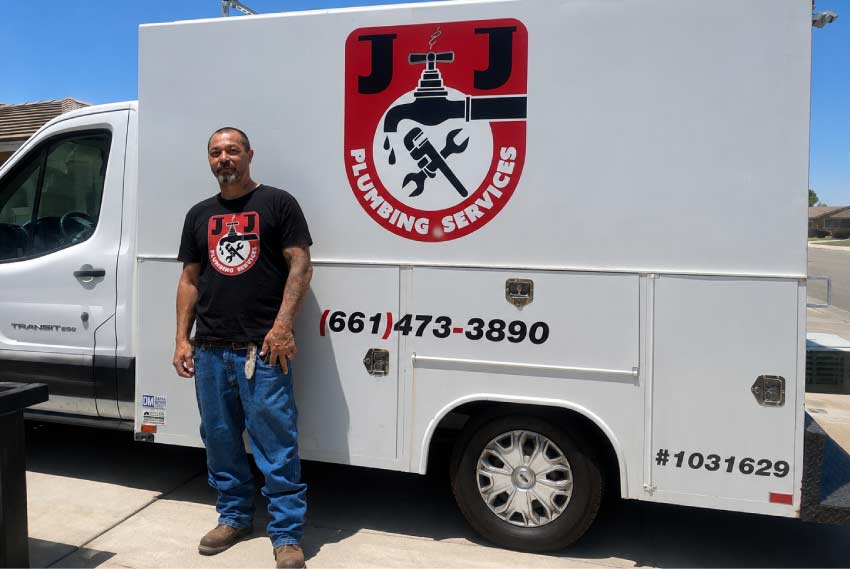 Joe Pergis standing next to the J&J Plumbing Services branded service truck in Bakersfield, CA
